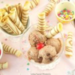 These crispy Tuile Rolls aka Wafer rolls or Barquillos are buttery, sweet and easy to make. Perfect to serve with ice cream and desserts chocolate ice cream with cherry on top